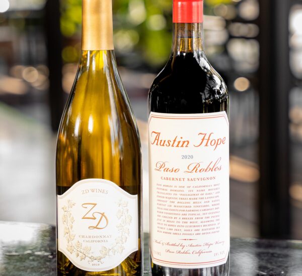 White and red wine bottles on a table